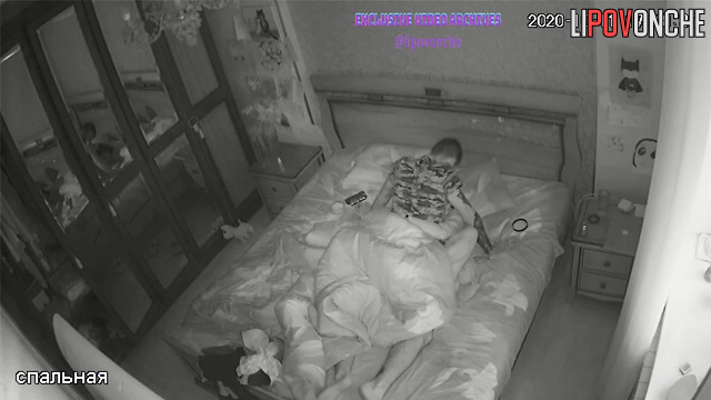 Young couple enjoying intimacy in cozy bed, spy cam