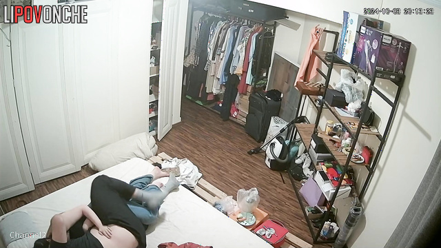 Сouple having fun in bed before going to sleep without even undressing