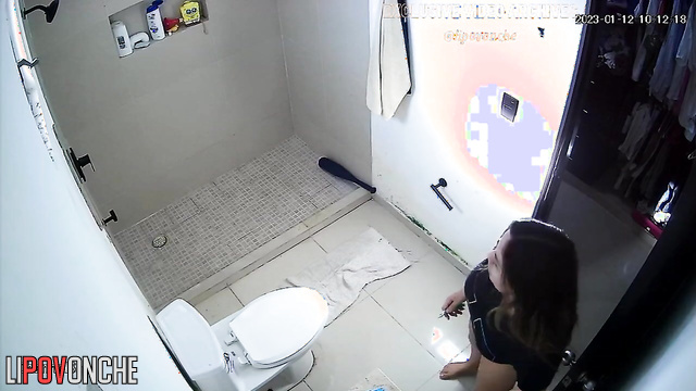 She sat on the toilet to shave her pubic hair, look